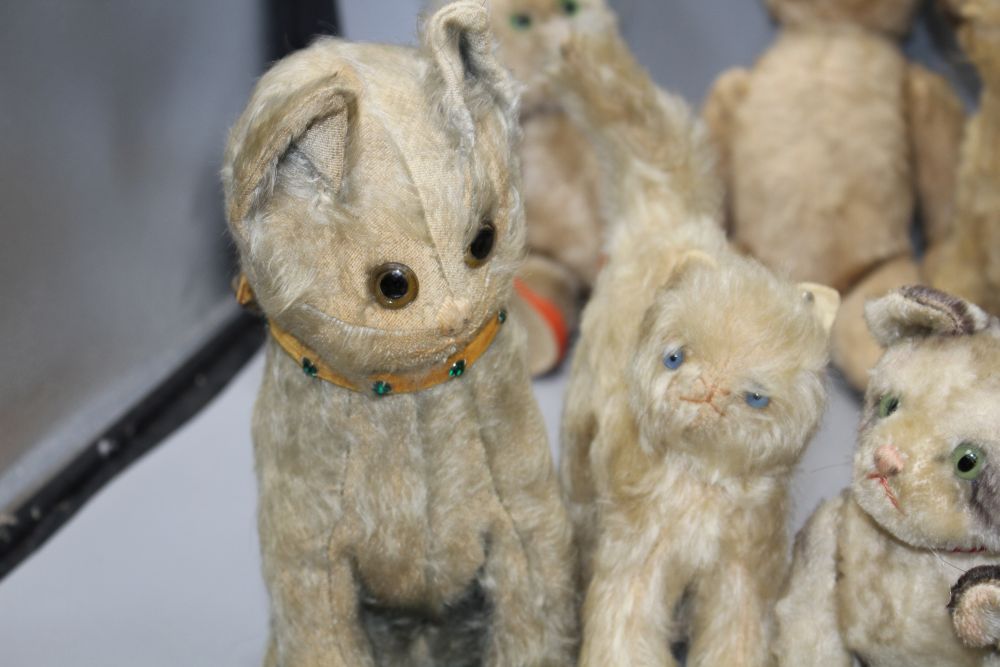 A collection of nine assorted vintage and later soft toy cats including Steiff